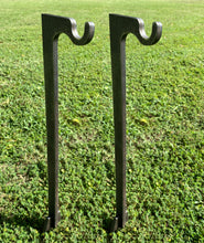Load image into Gallery viewer, Two 3/8in AR500 48 inch tall ground stake stands with integrated hooks for steel shooting targets, placed in green grass.