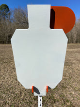 Load image into Gallery viewer, A 15inx30in 3/8in AR500 white and orange steel shooting target with interlocking swinging paddles and a Studded T-post mount outdoors.