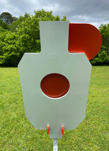 Load image into Gallery viewer, A 15inx30in 3/8in AR500 white and orange steel shooting target with interlocking swinging paddles and a Studded T-post mount outdoors.