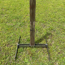 Load image into Gallery viewer, A 2x4 steel shooting target stand made of 2 legs and a crossbeam, placed on grass.