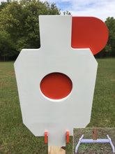 Load image into Gallery viewer, A 12inx20in 3/8in AR500 white and orange steel shooting target with interlocking swinging paddles, accompanied by a 2x4 mount and stand, set outdoors.