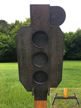 Load image into Gallery viewer, A 13inx30in 3/8in AR500 white and orange steel shooting target with interlocking swinging paddles, accompanied by a 2x4 mount and stand, set outdoors.