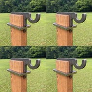 four wooden 2x4 posts with four 3/8in AR500 metal bracket hooks against a grassy background for steel targets